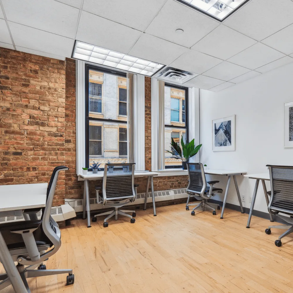 Office Space with multiple desks and comfy looking chairs