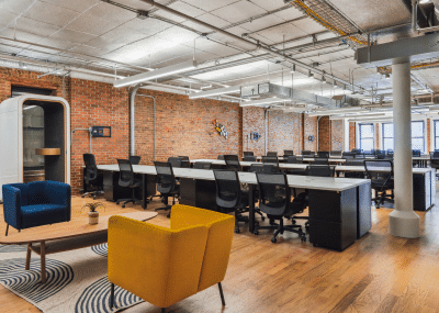 Coworking space with multiple chairs and areas for sitting.