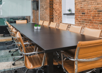 Conference room that fits 20+ participants, with large television and whiteboard visible.